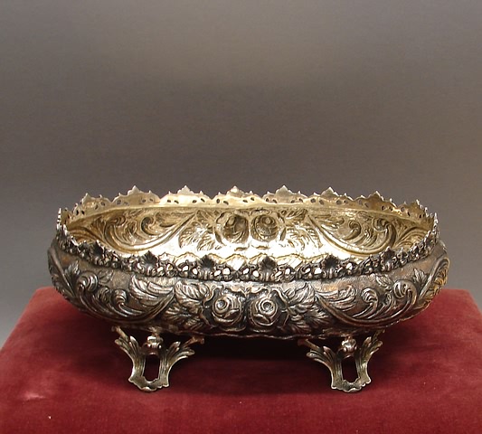 Appraisal: Oval form with pierced gallery repousse band of flowers and