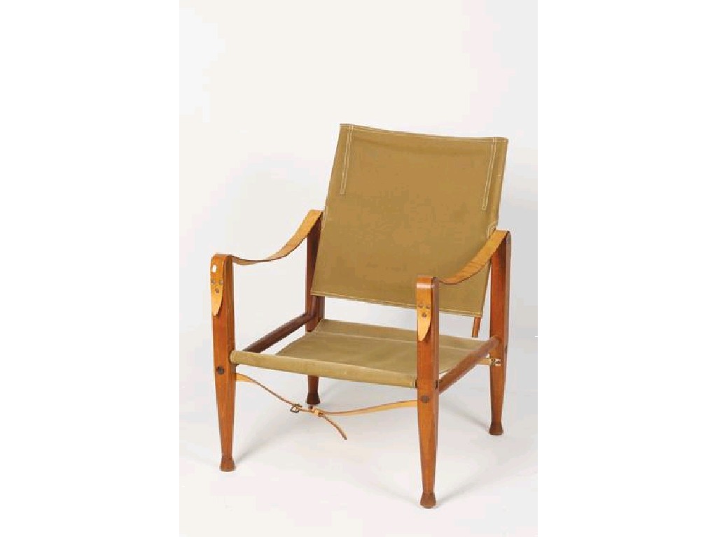 Appraisal: KAARE KLINT A SAFARI ARMCHAIR with canvas back and seat