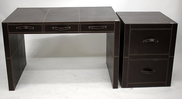 Appraisal: A CONTEMPORARY BROWN LEATHER CUPBOARD POSTAL DESK with three frieze