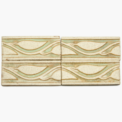 Appraisal: GRUEBY Sixty-eight border tiles embossed with leaves and stems in