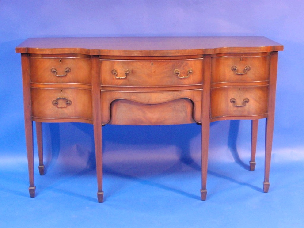 Appraisal: A reproduction Regency serpentine sideboard cm wide