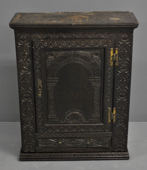 Appraisal: - English carved oak hanging cupboard probably th c with