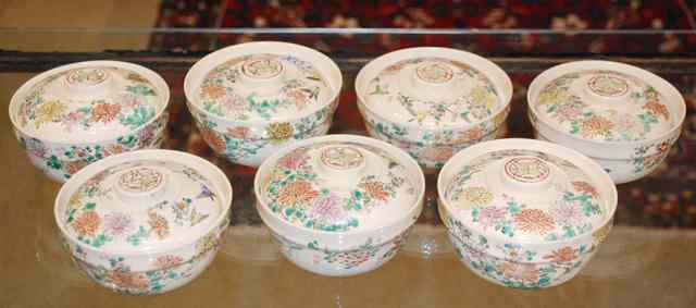 Appraisal: SEVEN CHINESE PORCELAIN COVERED SOUP BOWLS hand enameled in floral