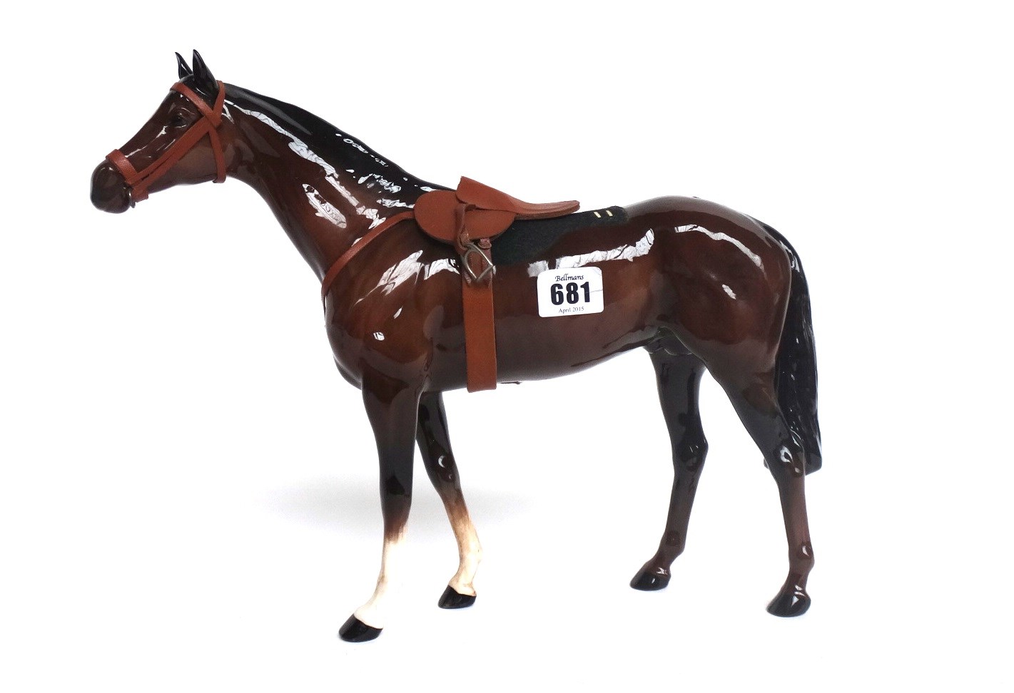 Appraisal: A Beswick brown gloss stallion with a leather saddle a