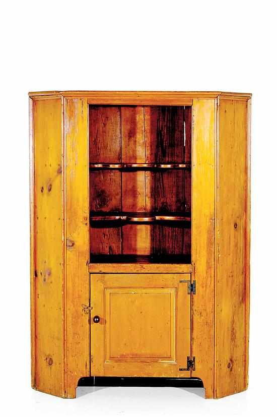 Appraisal: New England pine corner cupboard late th century molded top