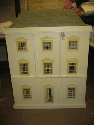 Appraisal: A late th century dolls house of manufactured painted wood