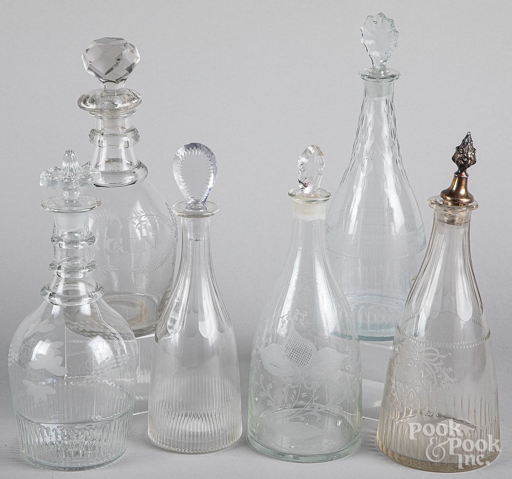 Appraisal: Six engraved colorless glass decanters th c Six engraved colorless