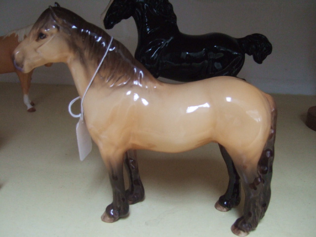 Appraisal: A Beswick Highland pony Mackionneach dun coloured