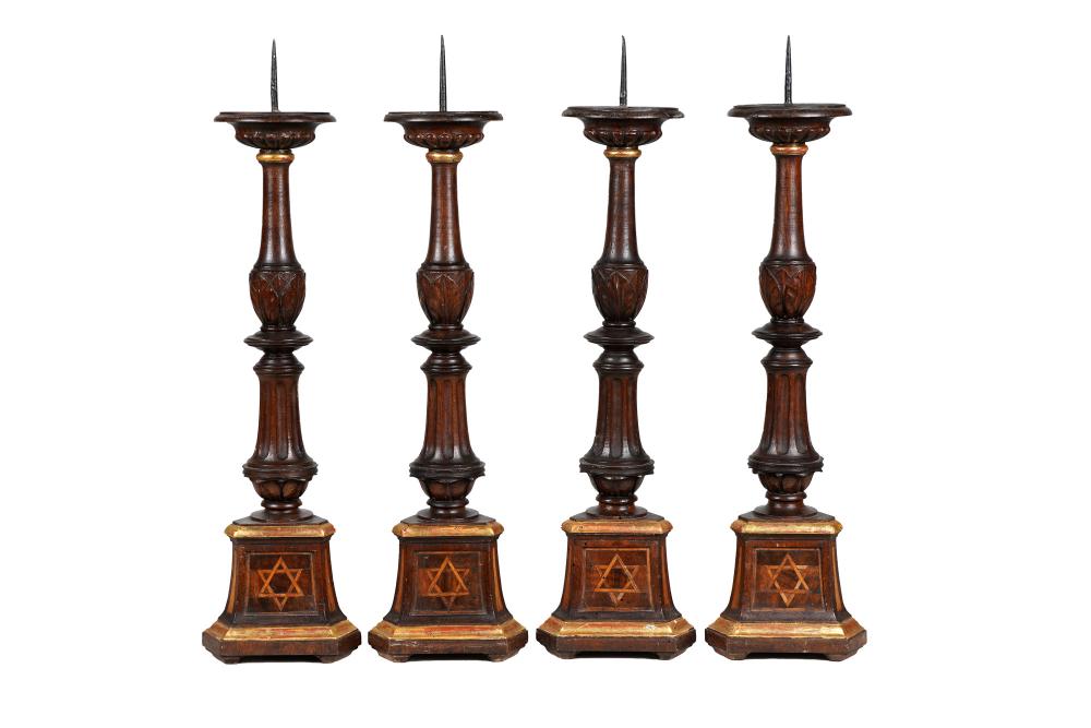 Appraisal: SET FOUR JUDAICA CARVED PARCEL GILT PRICKET STICKSeach with inlaid