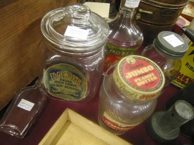 Appraisal: Glass Jars Bottles highlighted by Edgeworth Tobacco counter top jar