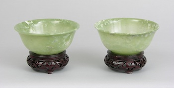 Appraisal: A Pair of Carved Jade Bowls Chinese A pair of