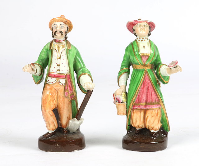 Appraisal: A PAIR OF TH CENTURY PORCELAIN FIGURES in the form