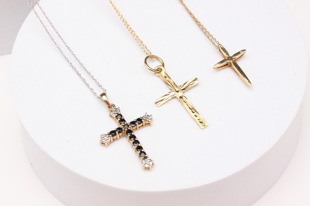 Appraisal: American late th century Three yellow gold crosses each with