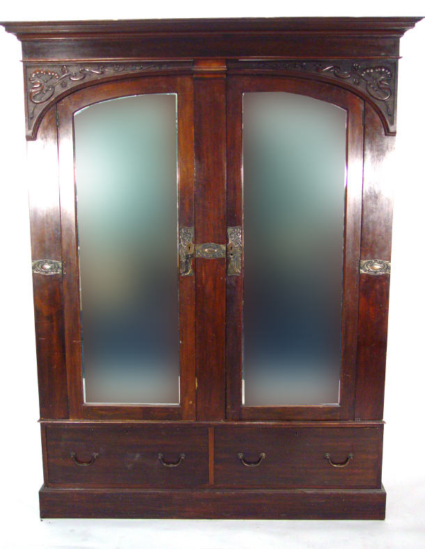 Appraisal: Art Nouveau mahogany double wardrobe the stepped cornice above a