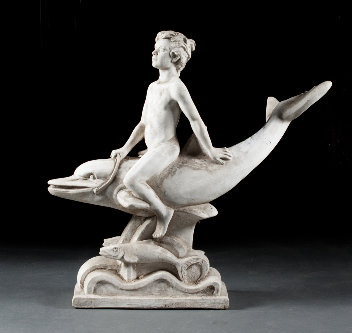 Appraisal: Cast concrete dolphin rider figure modeled as nude youth astride