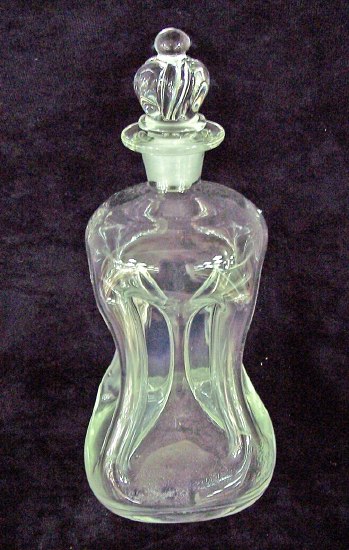 Appraisal: An hour glass shaped decanter and stopper with five funnels