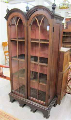 Appraisal: DOUBLE-DOOR CABINET BOOKCASE American c 's having a double-arch cornice