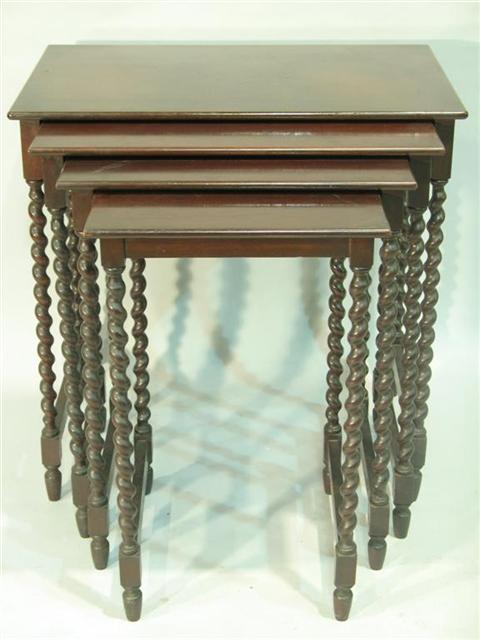 Appraisal: FOUR VICTORIAN STYLE MAHOGANY NESTING TABLES th century each with