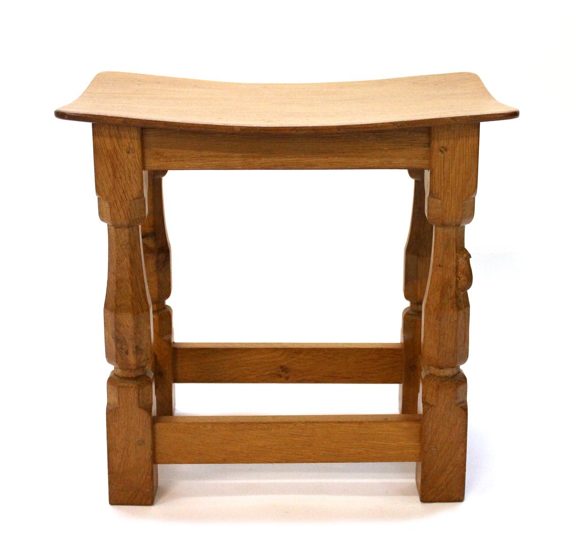 Appraisal: A Robert 'Mouseman' Thompson oak stool the dish adzed top