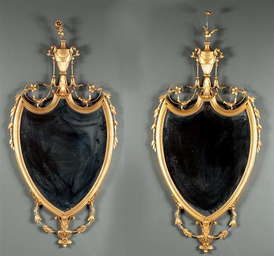 Appraisal: Pair of Regency style giltwood mirrors th century shield shape