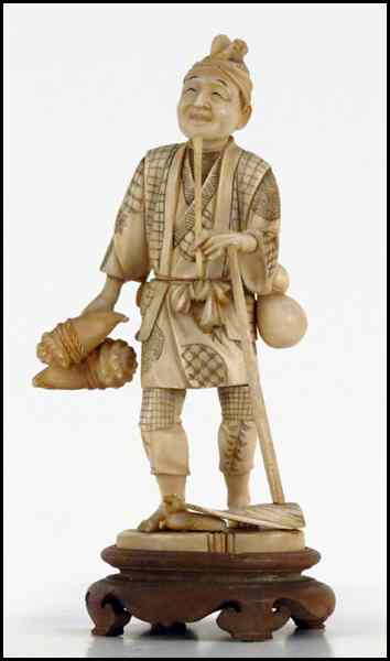 Appraisal: JAPANESE CARVED IVORY FIGURE OF A FISHERMAN Provenance The Collection