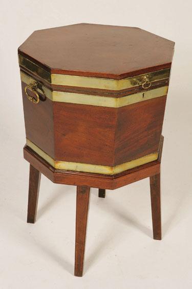 Appraisal: A REGENCY MAHOGANY OCTAGONAL CELLARETTE ON STAND the shaped top