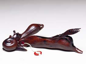 Appraisal: TWO CONTEMPORARY SASHI-TYPE NETSUKE Two rare contemporary carved wood sashi-type