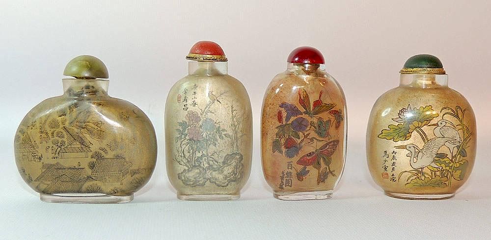 Appraisal: Four Interior-Painted Glass Snuff Bottles Four interior-painted glass snuff bottles