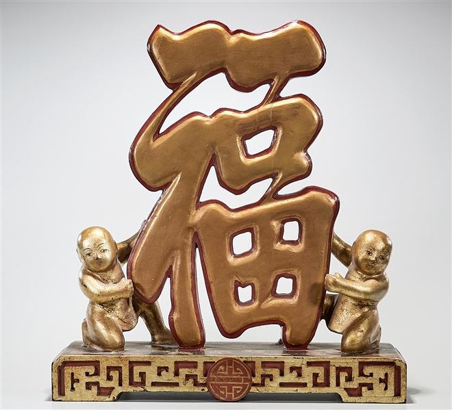 Appraisal: Chinese painted wood fortune characater with child figure x x