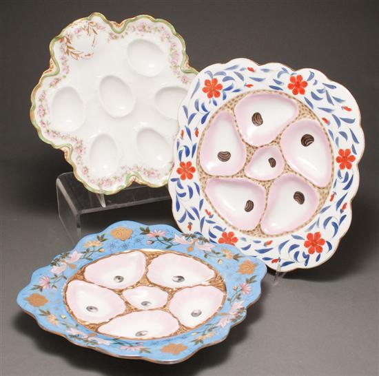 Appraisal: Two Austrian floral painted parcel-gilt porcelain oyster plates and a