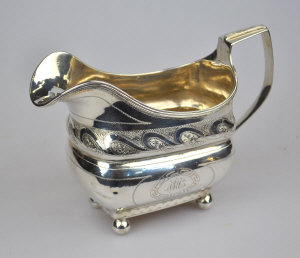 Appraisal: A George III Irish silver milk jug with engraved decoration