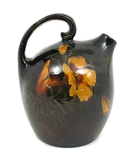 Appraisal: An Owens art pottery brown-glazed Utopia height in width in