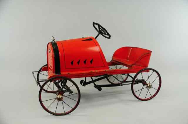 Appraisal: RED AMERICAN NATIONAL PEDAL CAR Pressed steel red body rubber