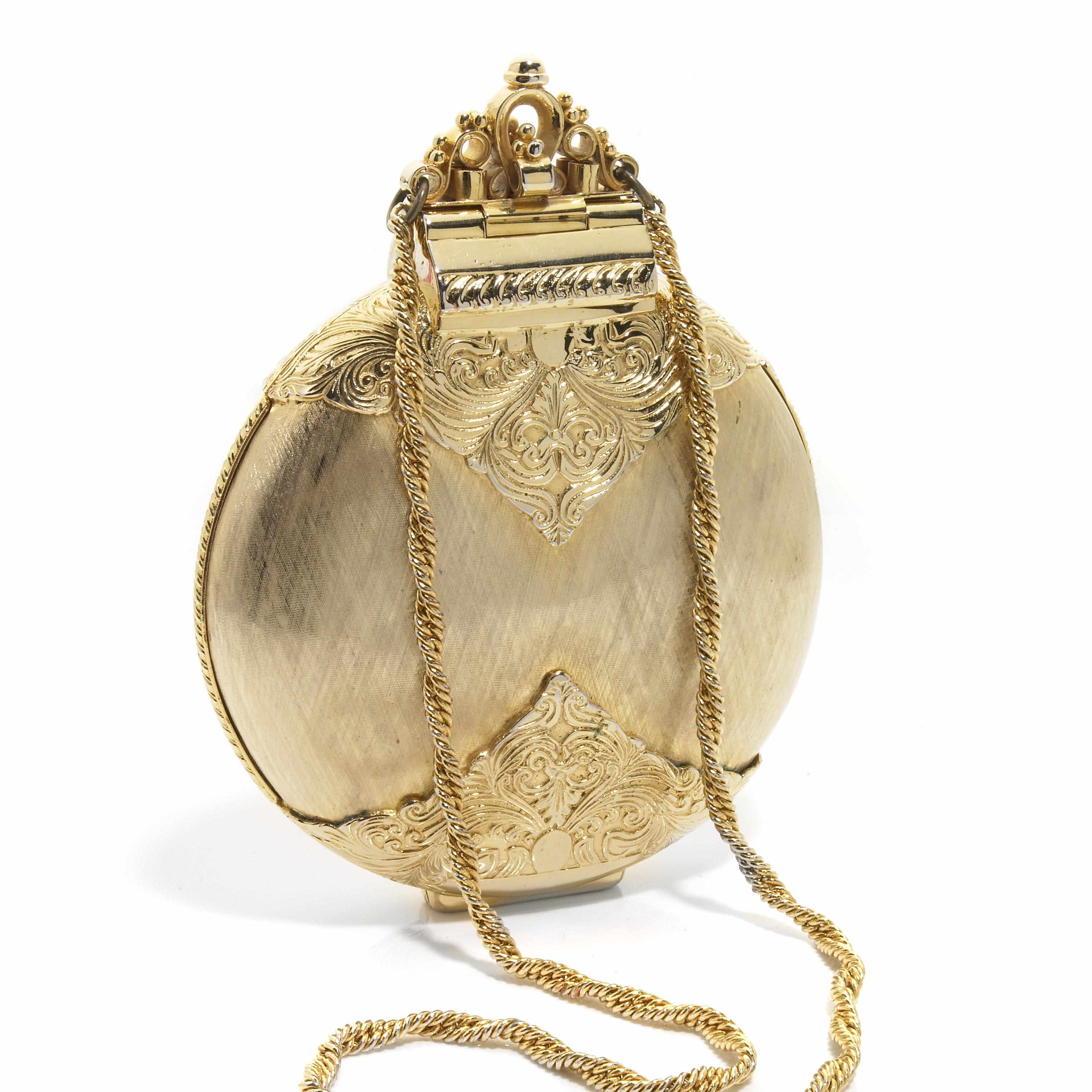 Appraisal: A gold colored metal embossed ''disc'' purse with attached strap