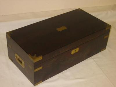 Appraisal: A ROSEWOOD WRITING SLOPE with brass banding hinged lid with