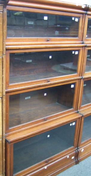 Appraisal: A th century walnut Globe Wernicke four section bookcase the