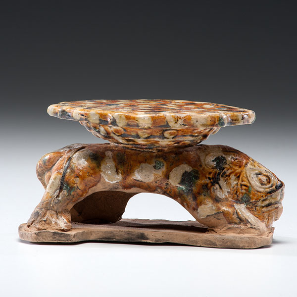 Appraisal: Liao Dynasty A glazed lion-form pillow having lower body finishing