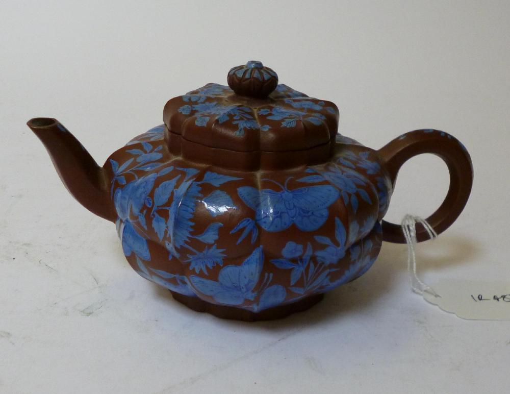 Appraisal: A YIXING REDWARE TEAPOT AND COVER th century of melon