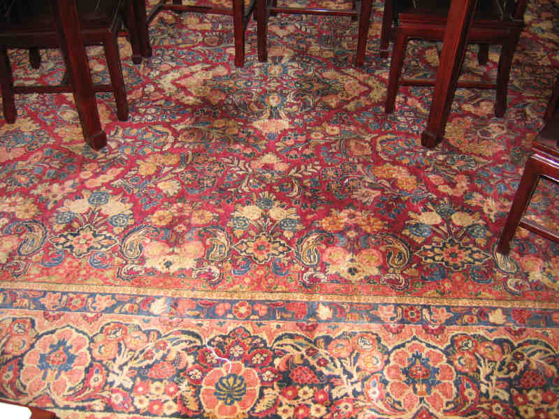 Appraisal: SAROUK ROOM RUG The red field with allover curvilinear floral