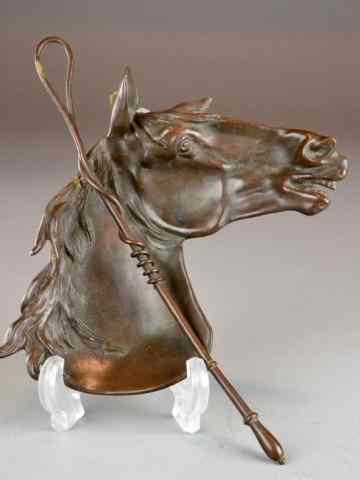 Appraisal: Bronze Horse SculptureBronze wall hanging of horse's head and riding