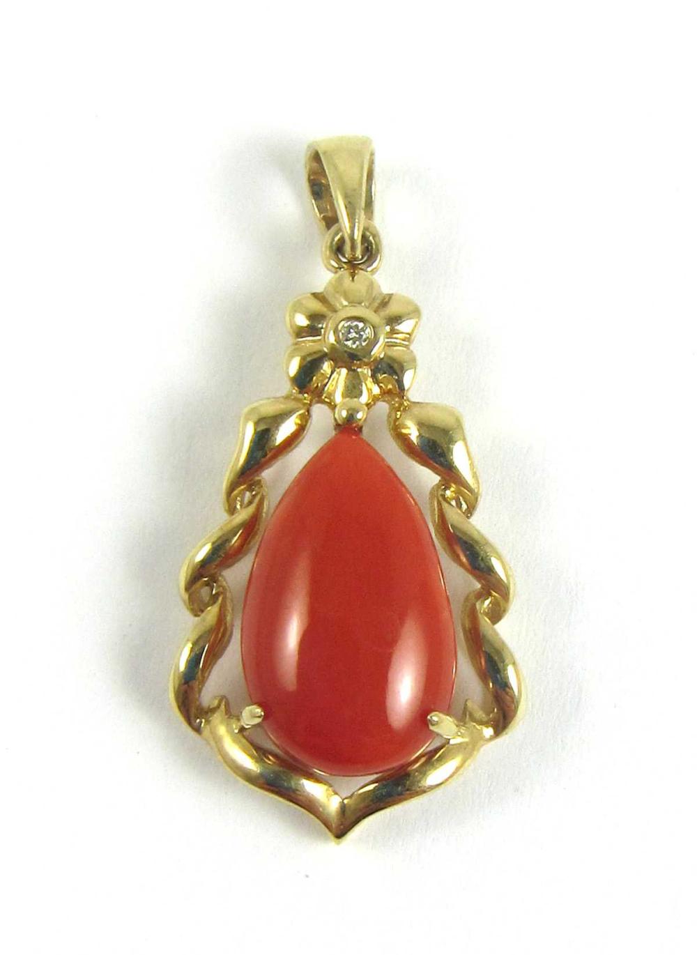 Appraisal: CORAL DIAMOND AND FOURTEEN KARAT GOLD PENDANT with a round-cut