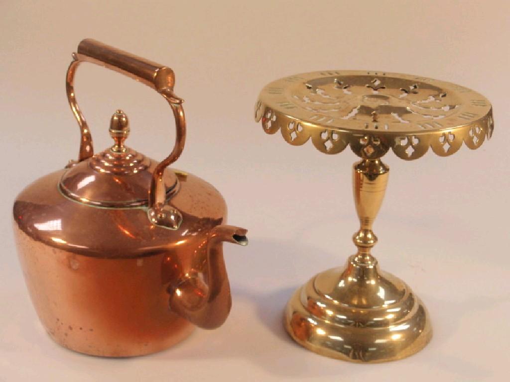 Appraisal: An antique copper kettle and a brass circular pierced trivet