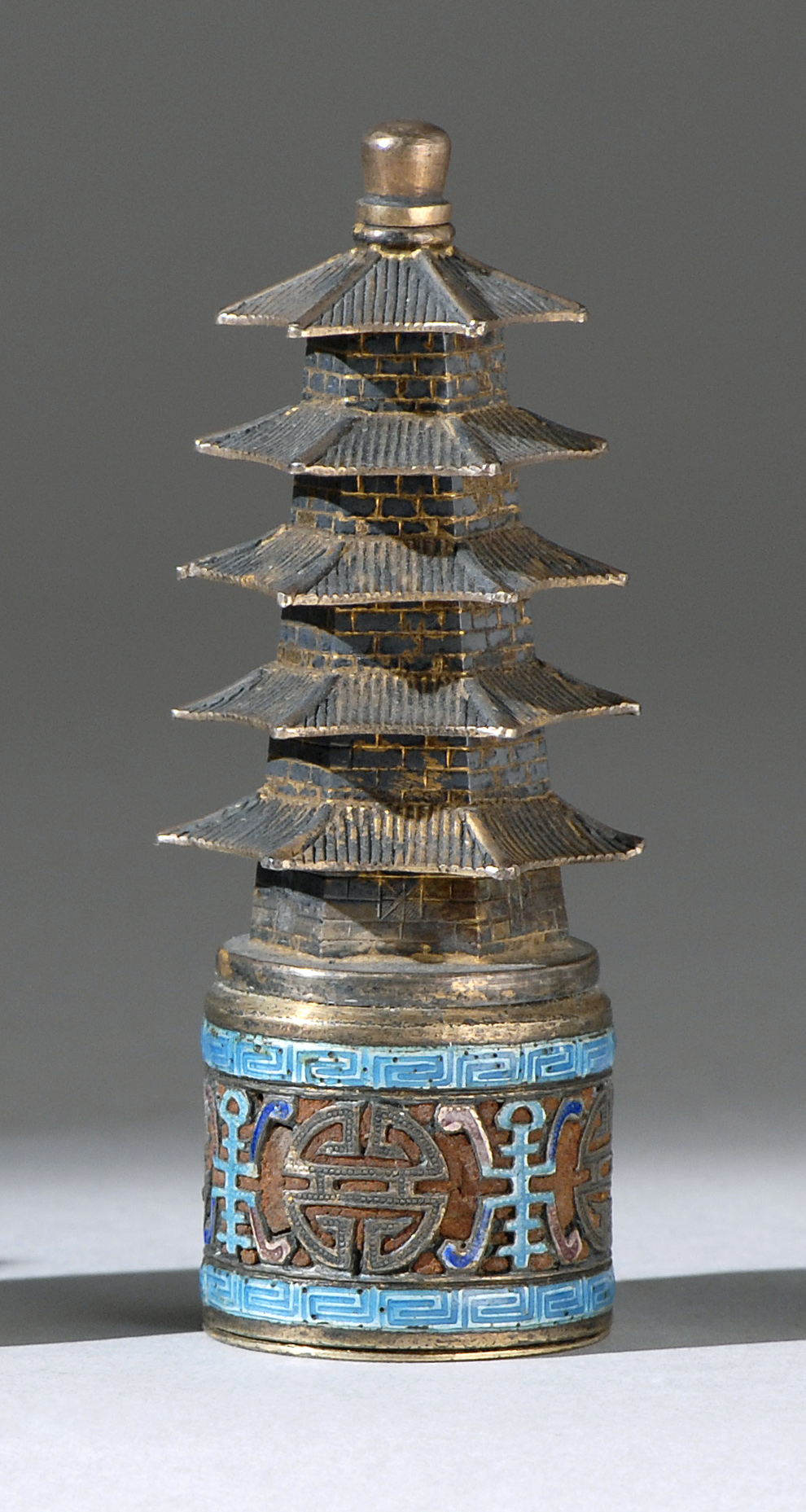 Appraisal: ENAMELED SILVER SNUFF BOTTLE Late th CenturyIn pagoda form using