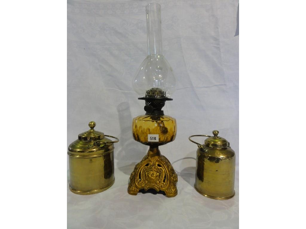 Appraisal: A Victorian oil lamp base with amber glass font raised