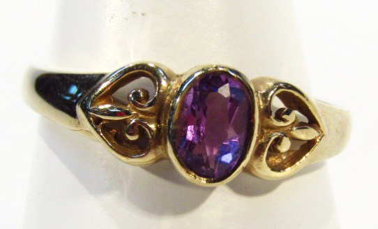 Appraisal: A ladies ct gold dress ring centred by purple stone