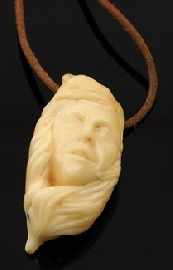 Appraisal: CARVED WHALES TOOTH PENDANT ON CORD