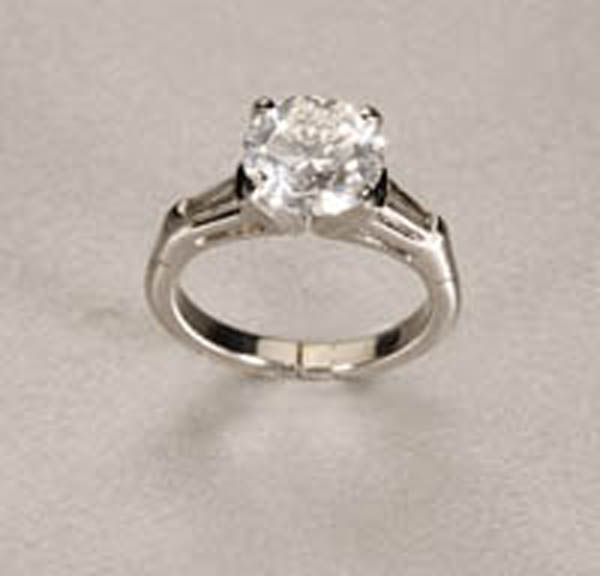 Appraisal: A solitaire diamond ring A solitaire diamond ring Platinum centering