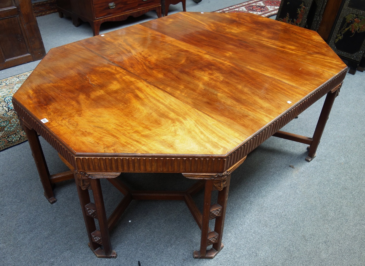 Appraisal: E W Beckwith an octagonal walnut dining table circa possibly