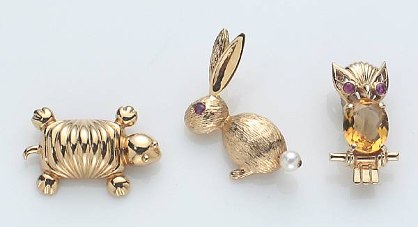 Appraisal: A collection of three gem-set and k gold animal brooches