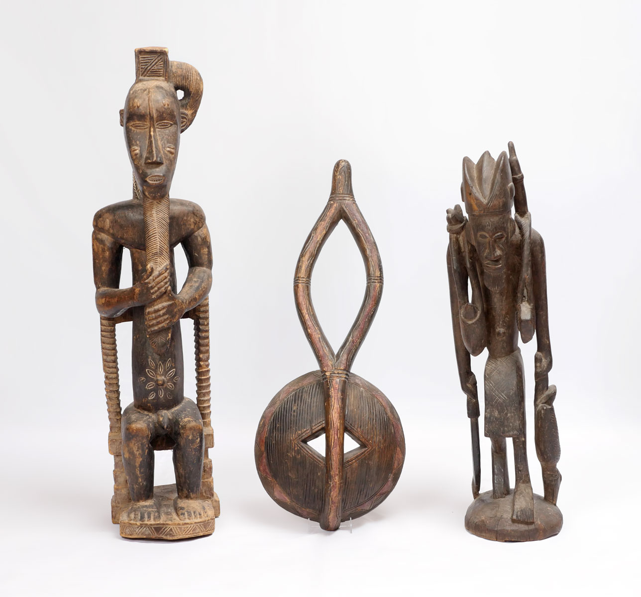 Appraisal: PIECE AFRICAN WOOD CARVINGS Measurements are as follows from left